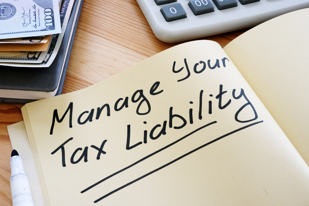 Manage your tax liability written in notebook